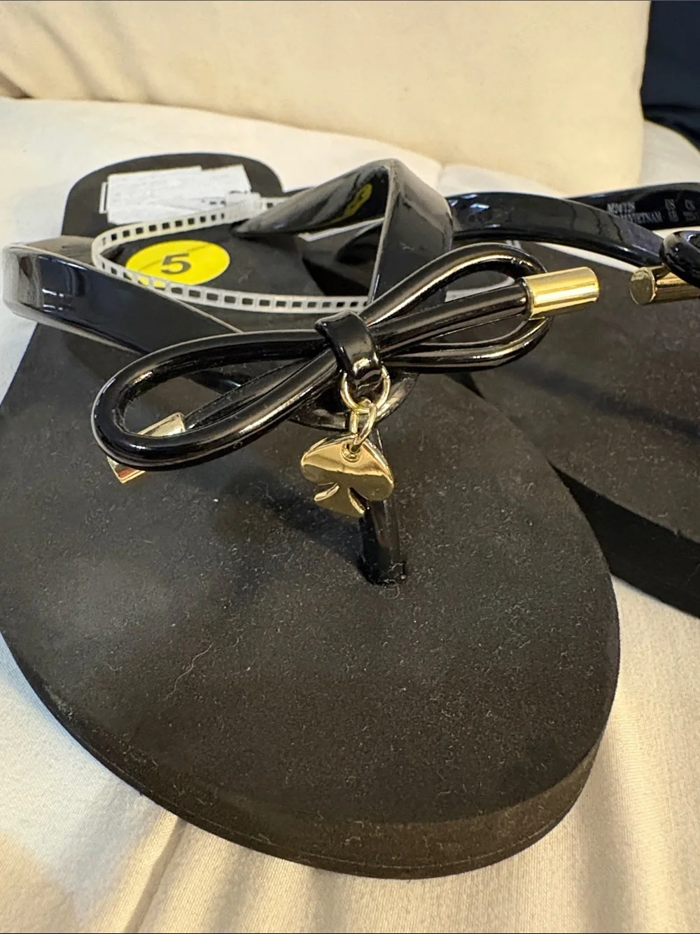 kate spade Black Bow Jelly Flip Flops with Gold Accents